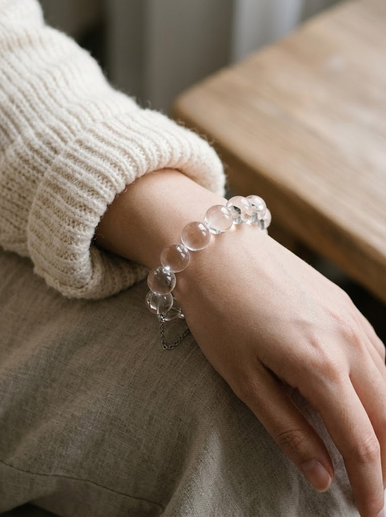 Clear bubble bead bracelet worn on wrist