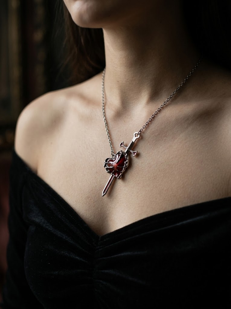 Gothic heart and sword necklace worn