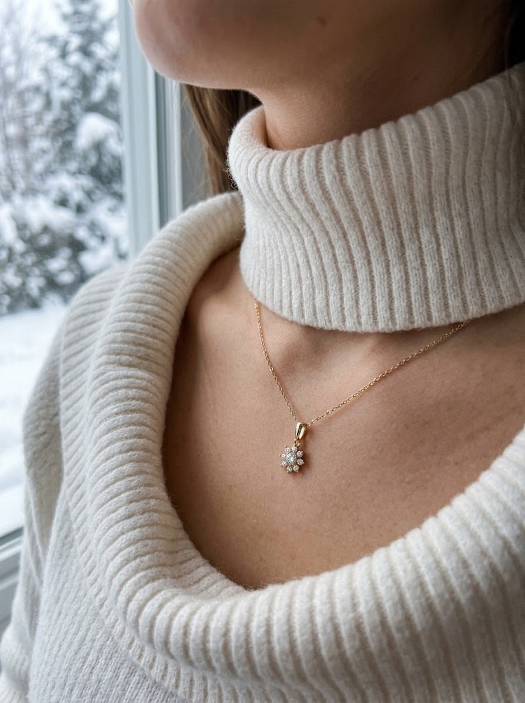 Snowflake necklace worn in winter with turtleneck